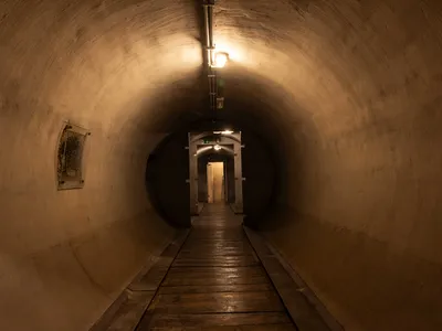 Located nearly 20 feet underground, this unfinished bunker is protected by 13-foot-thick concrete walls.

