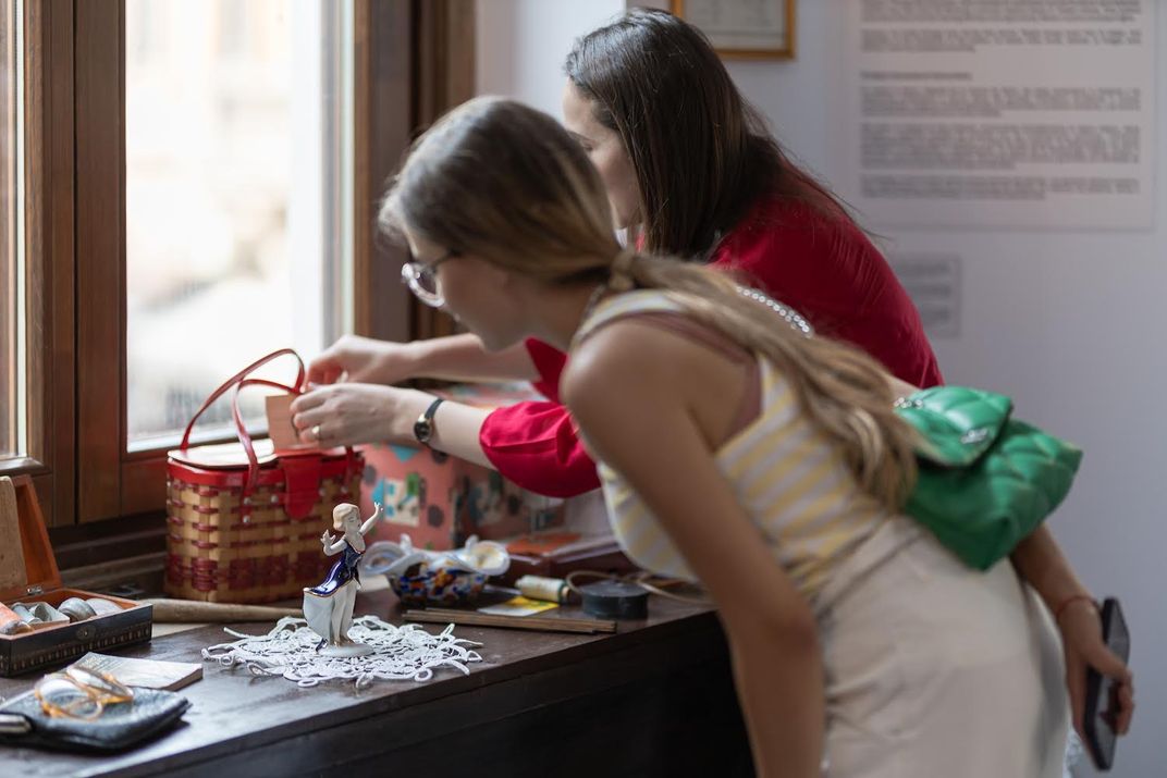 Visitors interacting with the Museum of Communism in Bucharest