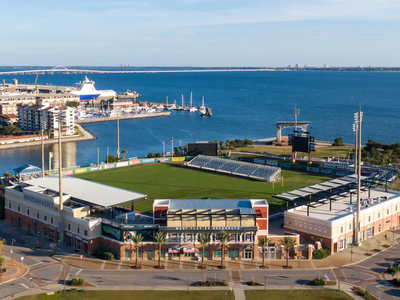 The stadium features views of Pensacola Bay.